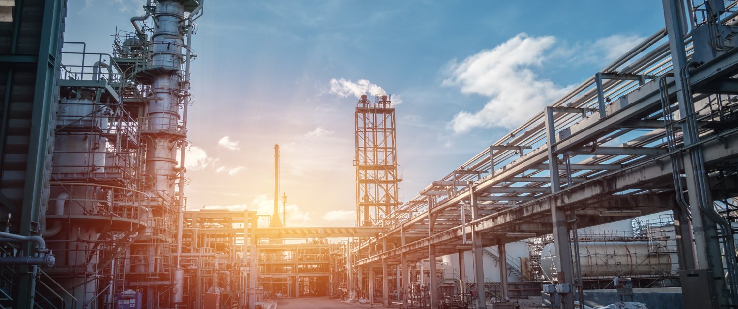 Pipeline and pipe rack of petroleum industrial plant with sunset sky background
